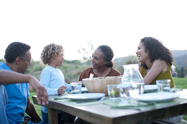 istock Family eating outdoors 169087138