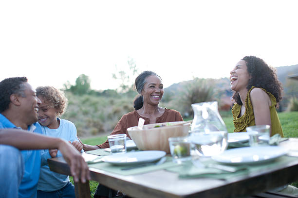 istock Family eating outdoors 169087139