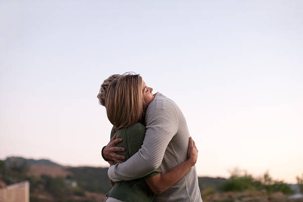 Couple hugging outdoors