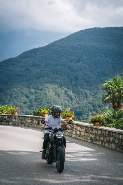 istock Motorcyclist rides mountain road 1690873852