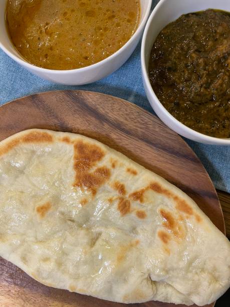 istock Indian curry and homemade naan 1690877847