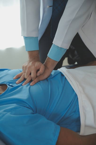 istock Medical professionals provide assistance to patients with unconscious, using an AED, by placing the electrode in the correct position. medical and healthcare concept. 1690878941