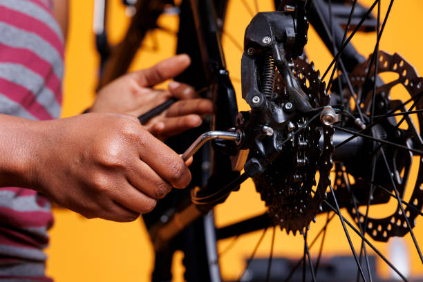 istock Woman grasping tool for bike maintenance 1690885376