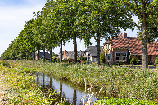 Street view of farm house along Jonkersvaart neighborhood in municipality Westerkwartier in Groningen province the Netherlands