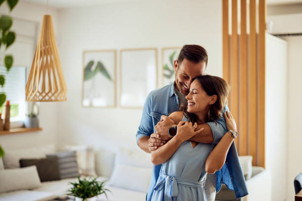 istock Beautiful lovers, hugging from the back, being at home. 1690896884
