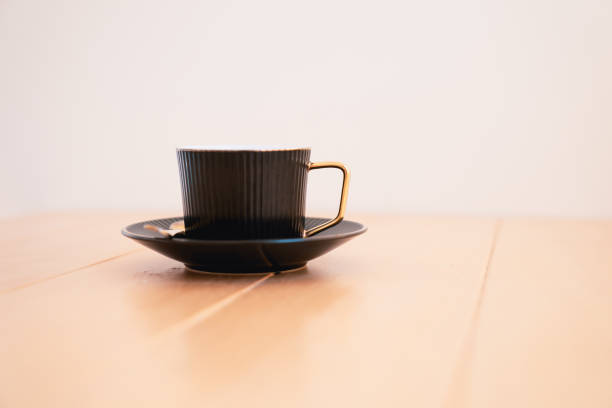 istock Cup of hot coffee on the wooden table. 1690914211