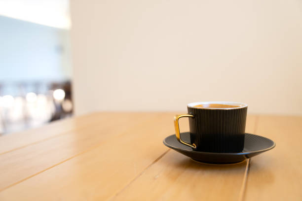 istock Cup of hot coffee on the wooden table. 1690915308