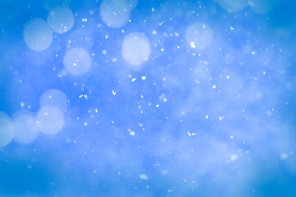 istock Blue blurred Christmas background with snowflakes 1690915481