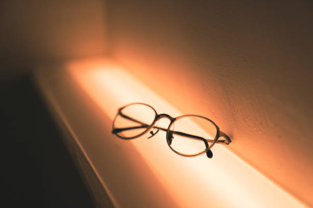 istock Stylish eyeglasses over pastel background. Optical store, glasses selection, eye test, vision examination at optician, fashion accessories concept. Top view, flat lay 1690921071