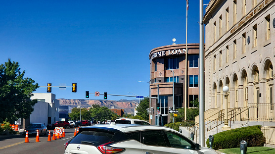 Grand Junction, Colorado, USA- September 16, 2023: Looking west on Rood Avenue from downtown Grand Junction, Colorado to the red cliffs of Colorado National Monument.