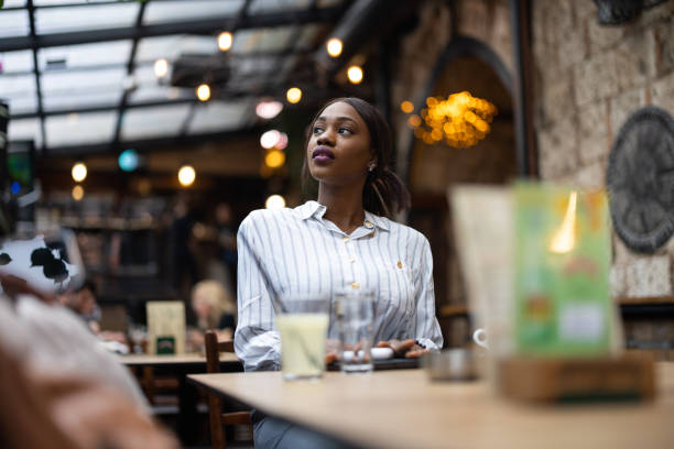 istock Beautiful woman sitting in cafe 1690921400