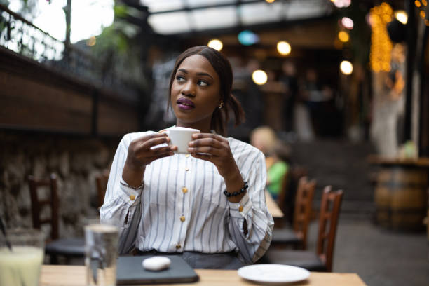 istock Beautiful woman sitting in cafe 1690921427