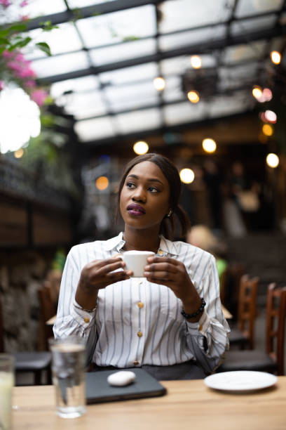 istock Beautiful woman in cafe 1690921440
