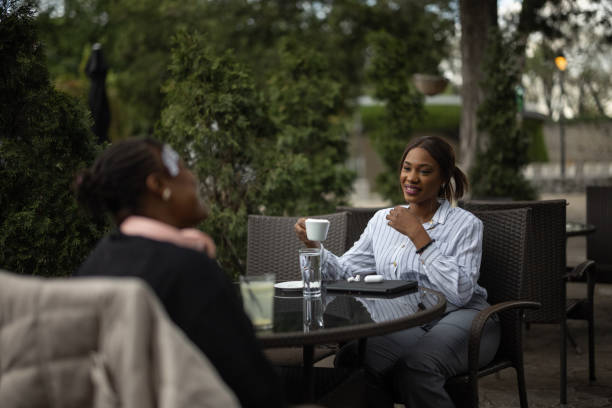 istock Women friends sitting in cafe 1690921781