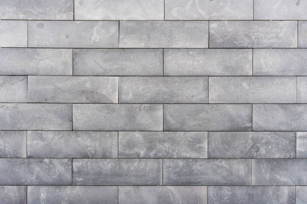 istock Old grey brick wall background. Texture of building wall. 1690923196