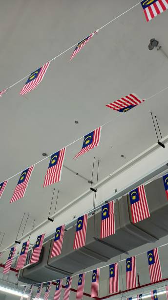 istock Hanging small Malaysia flags in a mall 1690923320