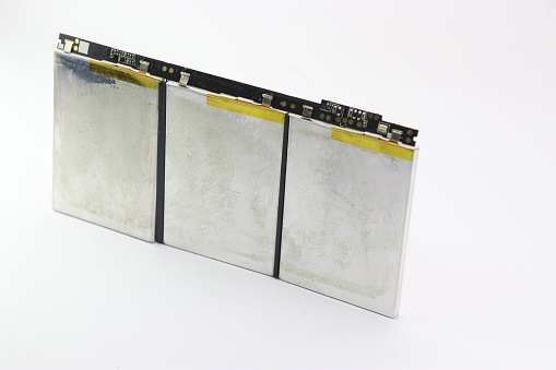 Lithium polymer battery arranged in an order kept on a white background. Modern laptops are powered by li-po battery