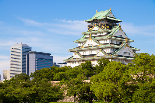 Osaka castle with skyscrapers of Osaka business park in Japan