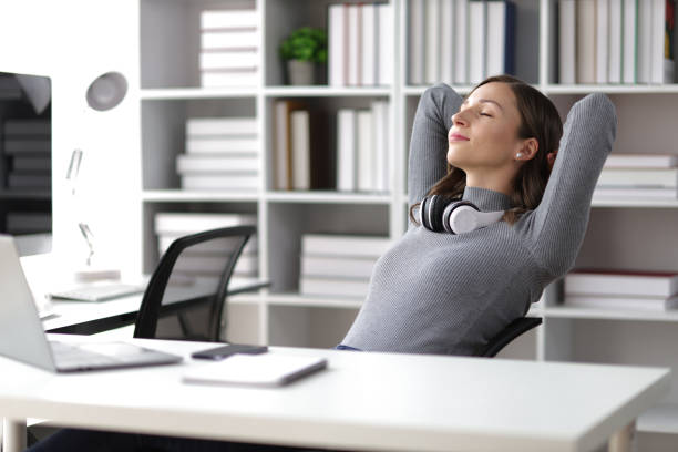 istock Woman doing stretching pose to relax in office. 1690927128