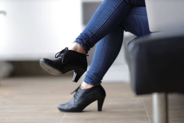 istock Female legs sitting on sofa with sexy. 1690927206