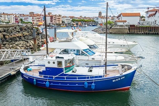 Ciboure, France - September 16, 2023 : Blue fishing boat in the Larraldenia marina in Ciboure, France