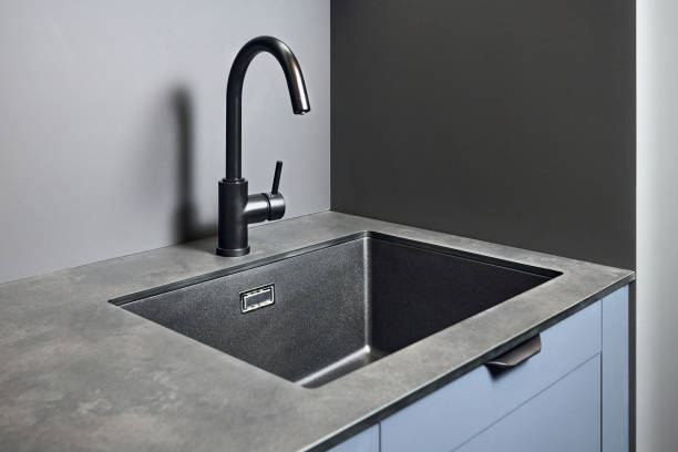 istock Single handle water filter kitchen faucet for reverse osmosis or water filtration system built in compact high pressure laminate HPL countertop. Kitchen undermount installation granite composite sink. 1690931304
