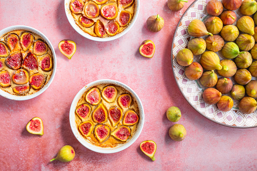 French fig clafoutis with almonds in baking form, glutenfree dessert