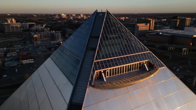 Drone footage over the Memphis Pyramid at sunset in downtown Memphis, Tennessee, USA
