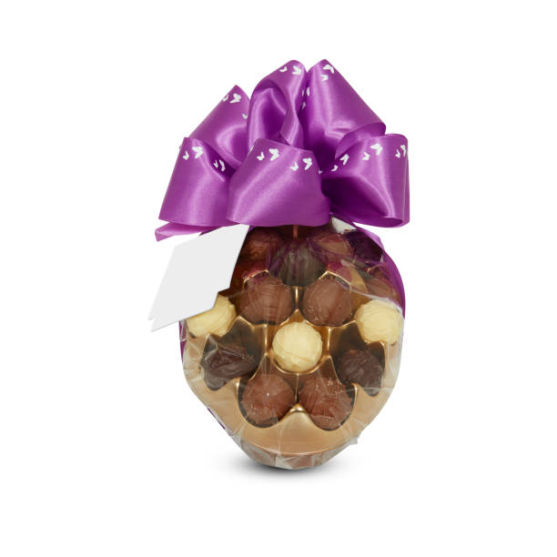 istock Chocolate in a plastic bag with a ribbon cut out isolated white background with clipping path 1690934968