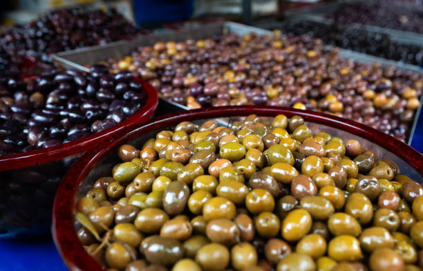istock Freshly marinated olives at the market. 1690935692