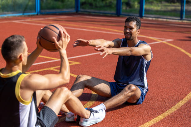 istock Two man friends athlete having workout together on outdoors court. 1690935889