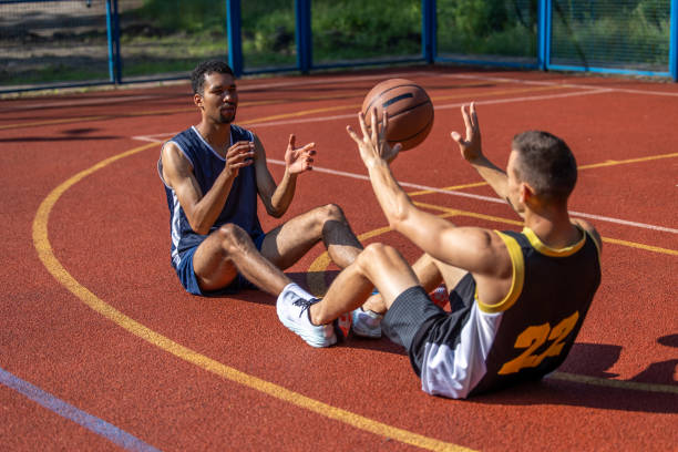 istock Two man friends athlete having workout together on outdoors court. 1690935908