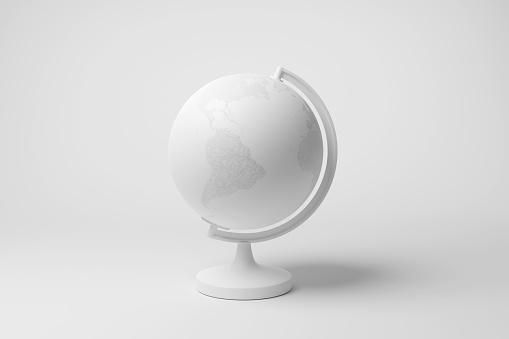 White desktop globe on white background in monochrome and minimalism. Illustration of the concept of world travel destinations and vacations