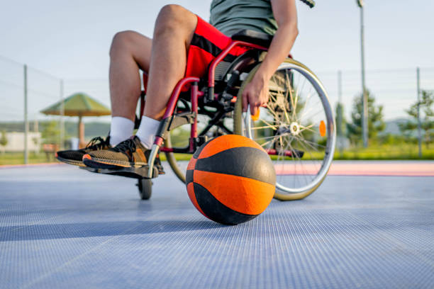 istock Disabled man training on basketball court 1690938361