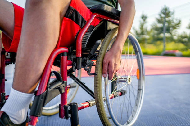 istock Disabled man training on basketball court 1690938376