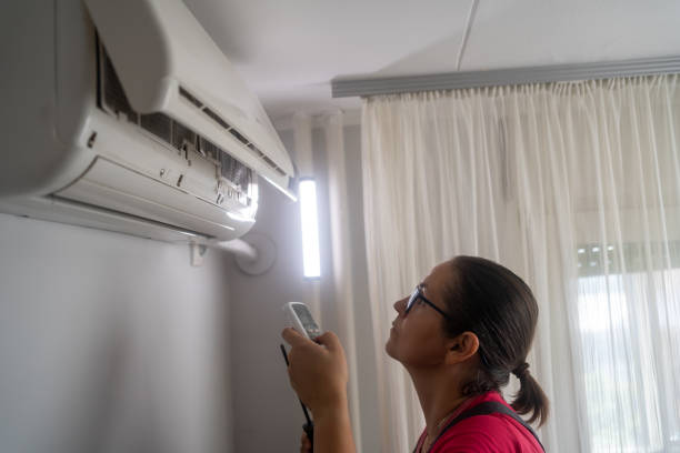 istock Technician repairing air conditioner 1690939479