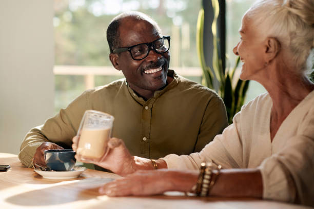 istock Senior couple drinking coffee in cafe 1690940138