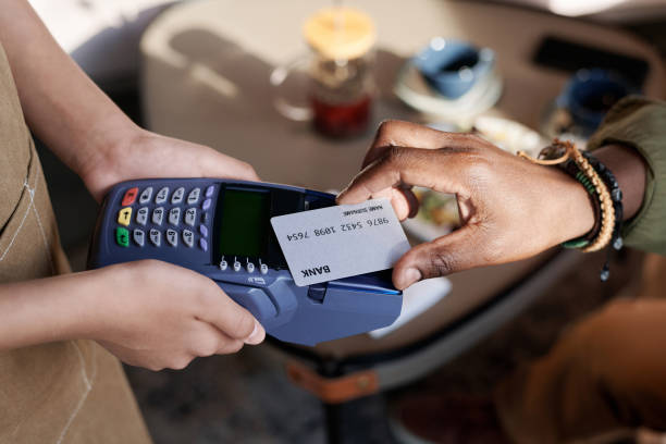 istock Man paying for lunch with credit card 1690940276