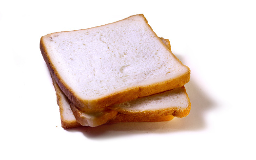 Slices of bread photographed on brown background