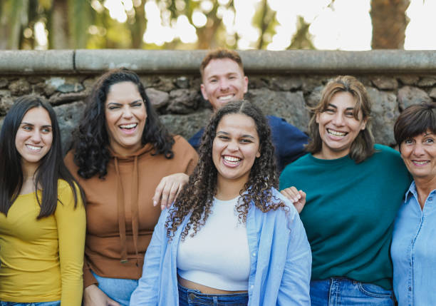 istock Group of multi generational people having fun together outdoor while smiling in front of camera - Community and inclusion concept 1690944894