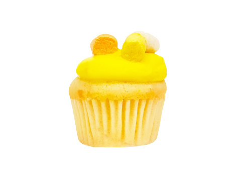 Cupcake with yellow or pineapple cream topping isolated on white background with clipping path or make selection. Dessert food