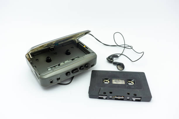 istock Vintage audiotape and earphone isolated on white background 1690947061