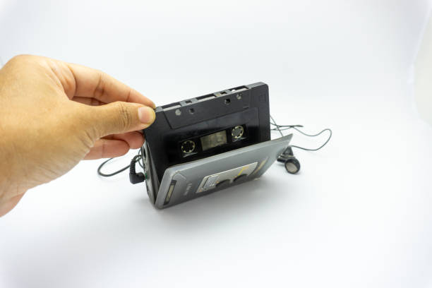 istock Vintage audiotape and earphone isolated on white background 1690947064