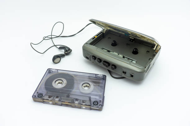 istock Vintage audiotape and earphone isolated on white background 1690947090