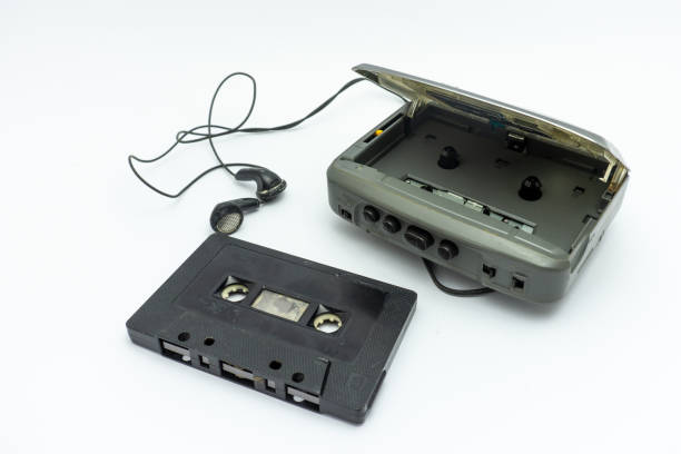 istock Vintage audiotape and earphone isolated on white background 1690947592