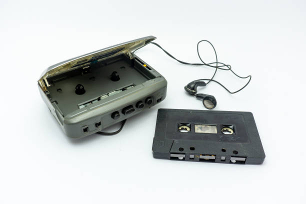 istock Vintage audiotape, earphone and cassette isolated on white background 1690947608