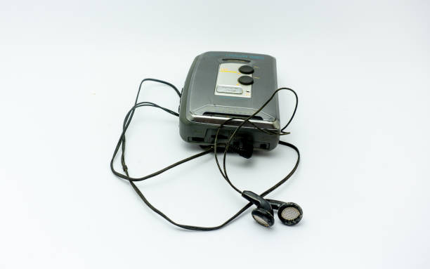 istock Vintage audiotape and earphone isolated on white background 1690947649