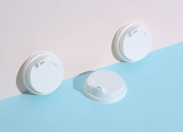 istock White lids for hot drinks on a pastel background with shadow. Creative layout, minimalism 1690958260