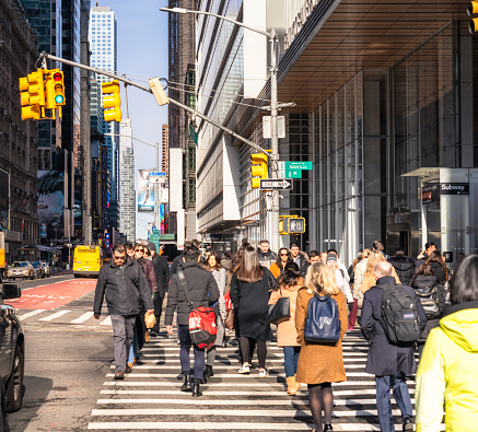 New York City, USA - Pedestrians crossing Sixth Avenue in Midtown Manhattan.