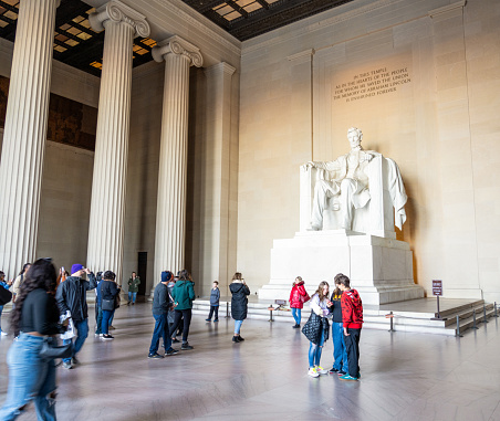Washington DC, USA - People visiting the Lincoln Memorial, featuring the large marble statue of the 16th US President Abraham Lincoln.